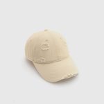 Cotton cap with distressing