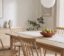 Small dining room with an oak table, spindle chairs and a paper pendant lamp